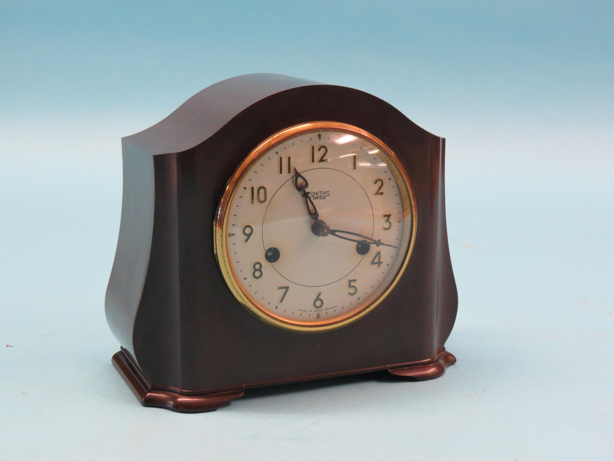 Appraisal: A Smiths bakelite mantel clock silvered dial and gong-striking movement