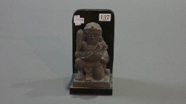 Appraisal: A sandstone figurine on a wooden stand s f