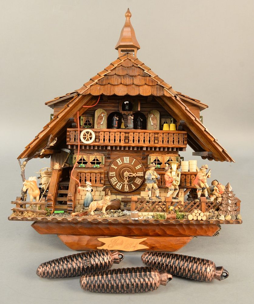 Appraisal: Black Forest-style German cuckoo clock three weights figures ht wd