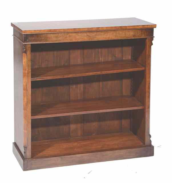 Appraisal: A WALNUT OPEN BOOKCASE with a crossbanded top above adjustable