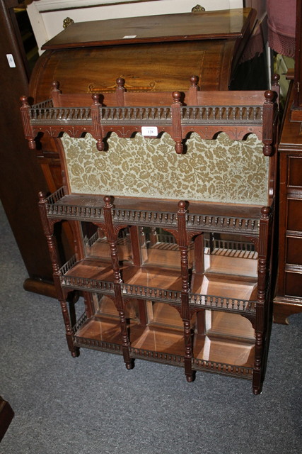 Appraisal: AN EDWARDIAN WALNUT WALL SHELF with turned supports mirror panels