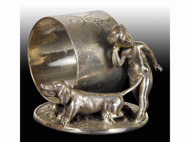 Appraisal: Cherubic Child Dachshund Dog Figural Napkin Ring Description Round base