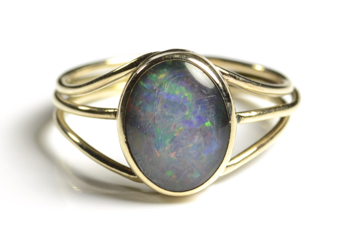 Appraisal: OPAL TRIPLET AND TEN KARAT GOLD RING featuring a bezel