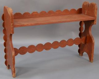 Appraisal: Red painted bucket bench having scallop carved back and support