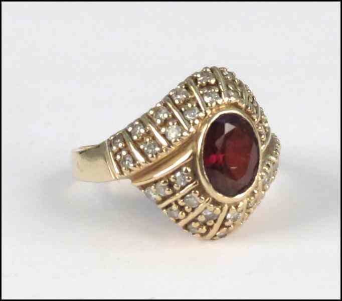 Appraisal: KARAT YELLOW GOLD DIAMOND AND GARNET RING grams Condition No