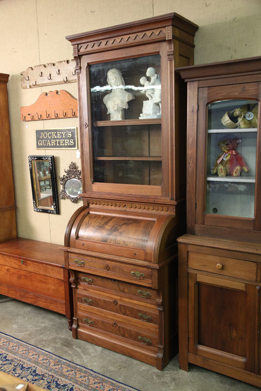 Appraisal: TWO PIECE CYLINDER SECRETARY BOOKCASE Walnut with carved crest reeded