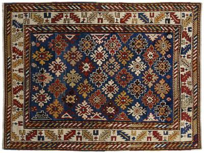 Appraisal: Caucasian rug diagonal rows of snowflake type designs on dark