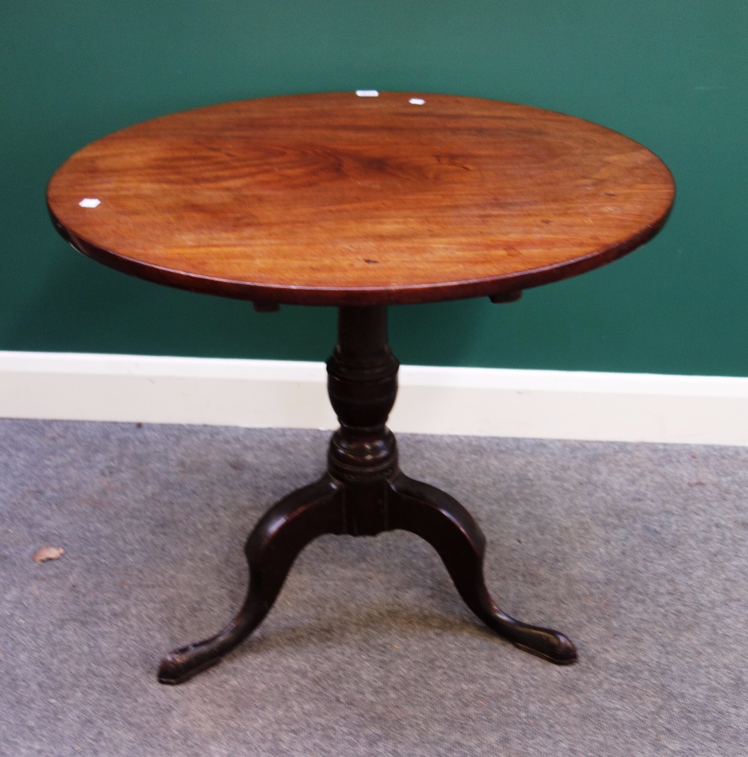 Appraisal: A mid th century mahogany occasional table the circular snap