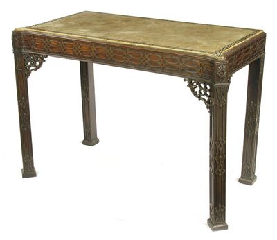 Appraisal: A mahogany console table of rectangular form with eared corners