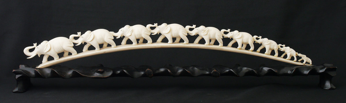 Appraisal: CARVED IVORY ELEPHANT BRIDGE elephant bridge '' long Affixed to