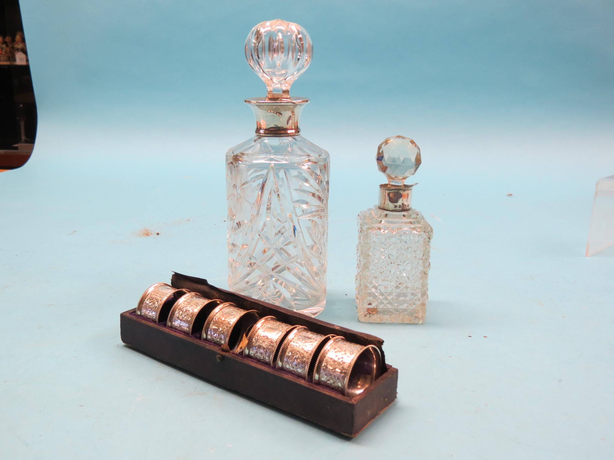 Appraisal: A silver-mounted glass decanter with stopper London in a silver-mounted