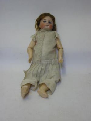 Appraisal: A Belton style bisque head girl doll with fixed blue