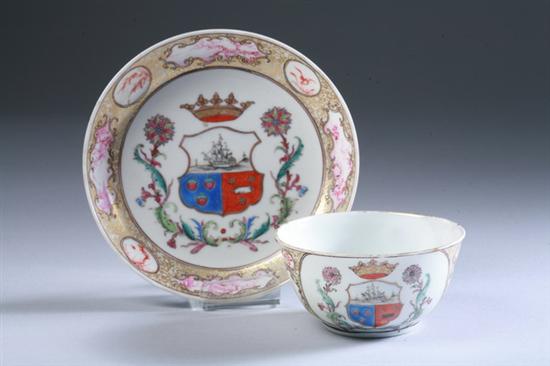 Appraisal: CHINESE ARMORIAL FAMILLE ROSE PORCELAIN CUP AND SAUCER circa Center