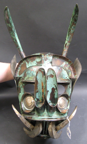 Appraisal: TWO PERUVIAN HAND MADE COPPER AND TIN FACE MASKS one