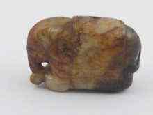 Appraisal: A Chinese brown jade pendant carved as an elephant x