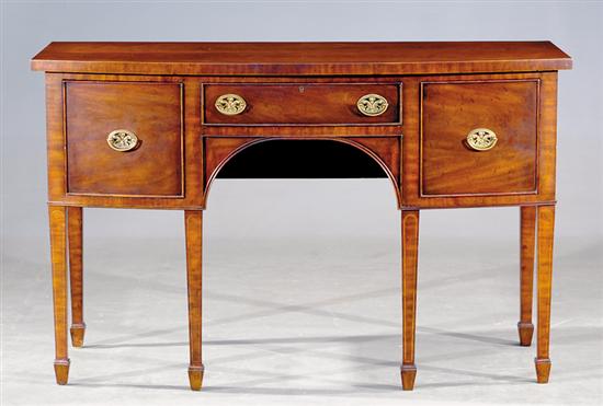 Appraisal: Mahogany bow front sideboard by Maitland Smith shaped top over