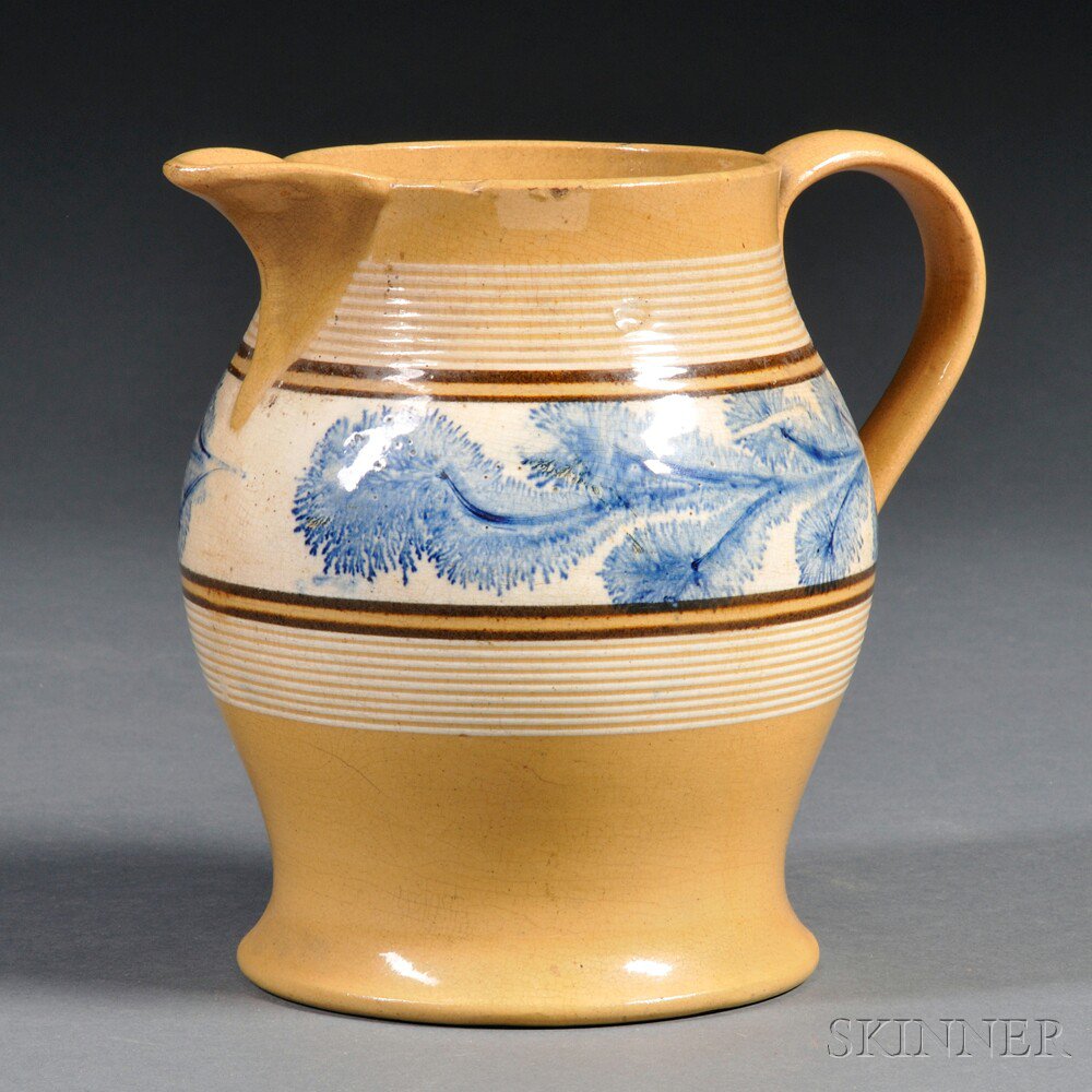 Appraisal: Yellowware Pitcher with Band of Blue Mocha Seaweed Decoration North