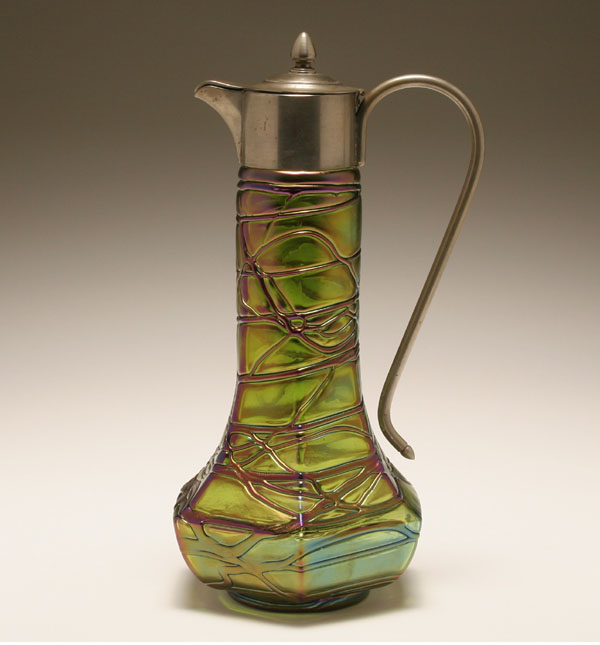 Appraisal: Austrian Jugendstil iridescent art glass claret jug pewter mounted iridescent