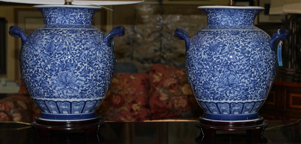 Appraisal: PAIR OF DECORATIVE BLUE AND WHITE JARS WITH HANDLES NOW