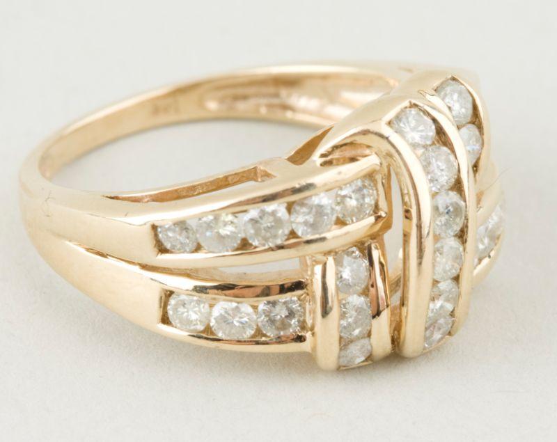 Appraisal: KT Yellow Gold Diamond Weave Motif Ring with round cut