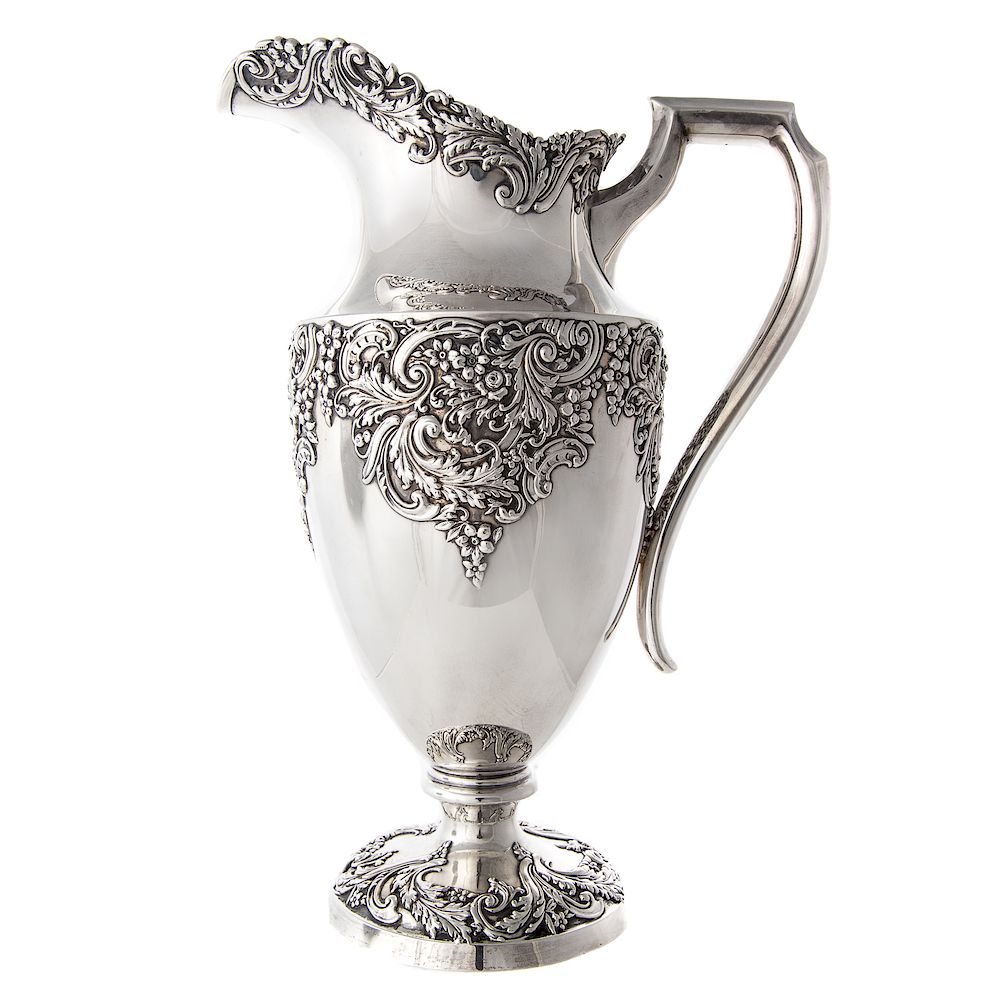 Appraisal: American sterling silver pitcher with scroll and foliate decoration retailed