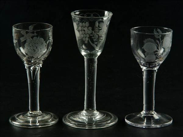 Appraisal: Three various engraved plain-stemmed wine glasses two with roses and