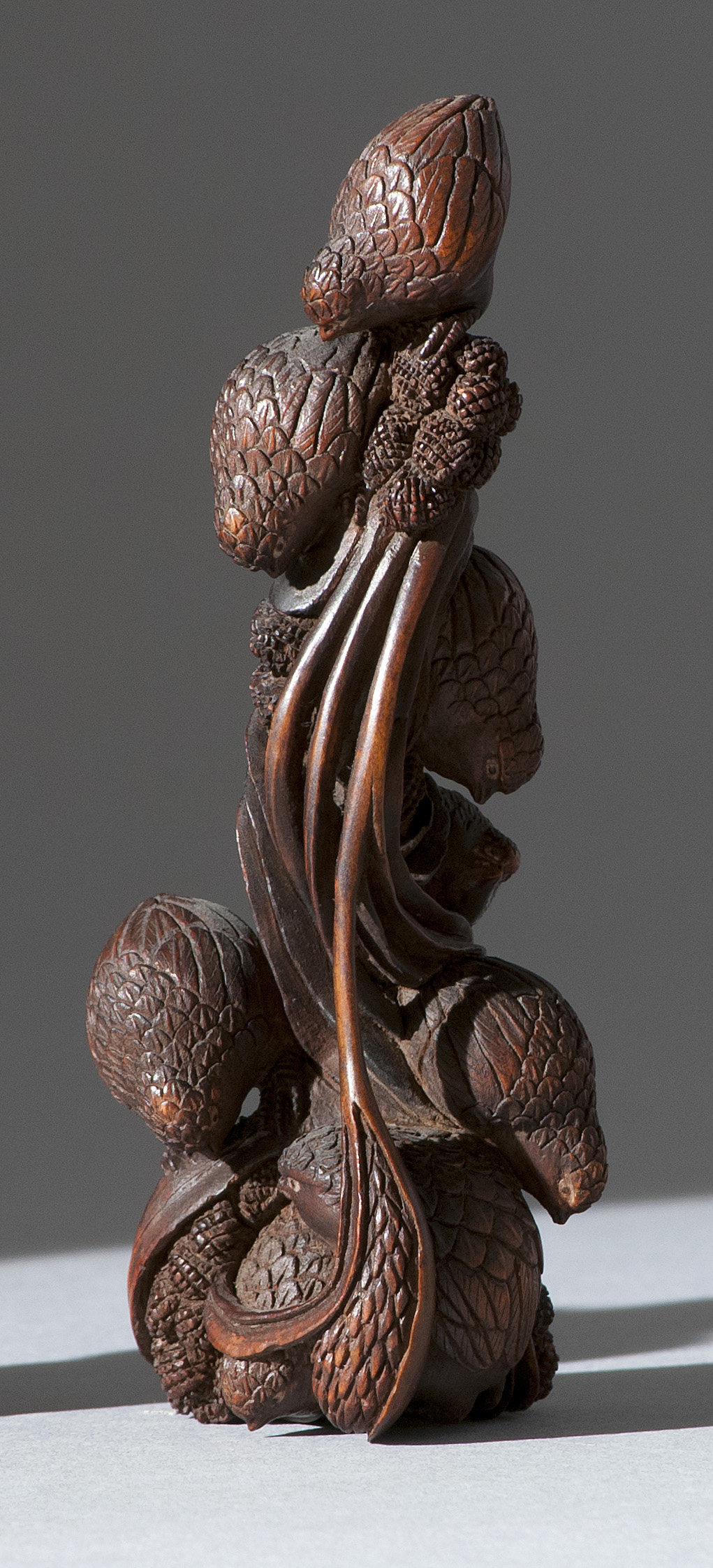 Appraisal: WOOD NETSUKE In the form of a covey of quail