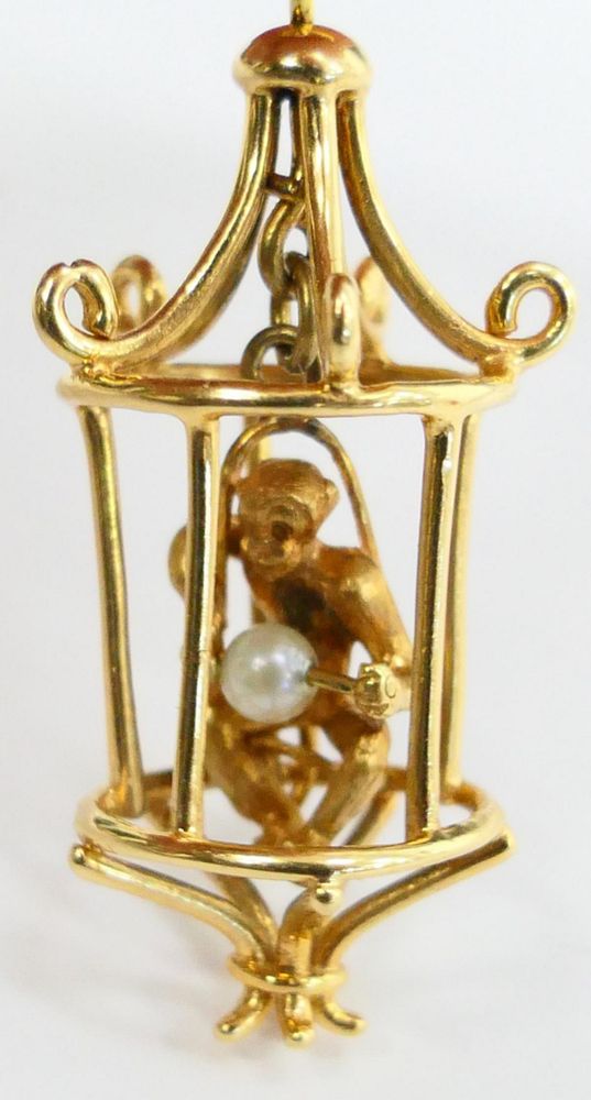 Appraisal: KT Y GOLD CHARM OF MONKEY IN CAGE Charm is