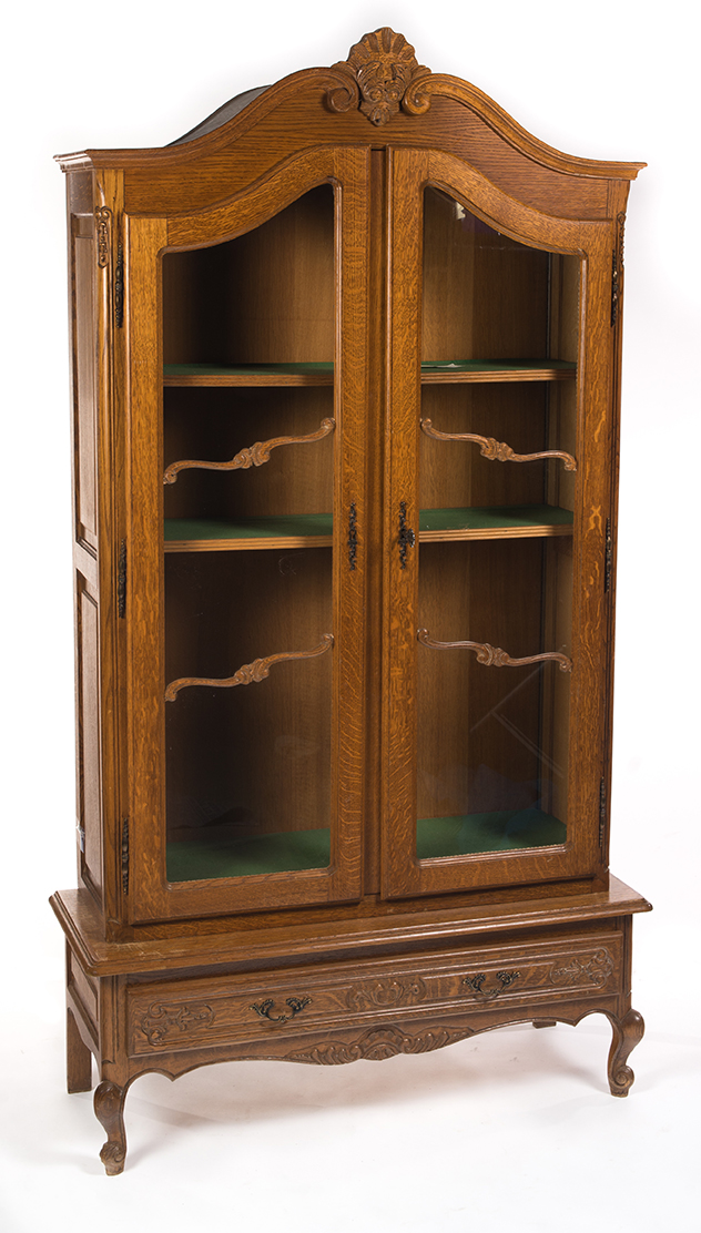 Appraisal: TWO-PIECE FRENCH-STYLE LIBRARY BOOKCASE European th century oak Decorative finial