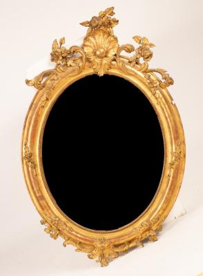 Appraisal: An early Victorian giltwood oval wall mirror with shell floral