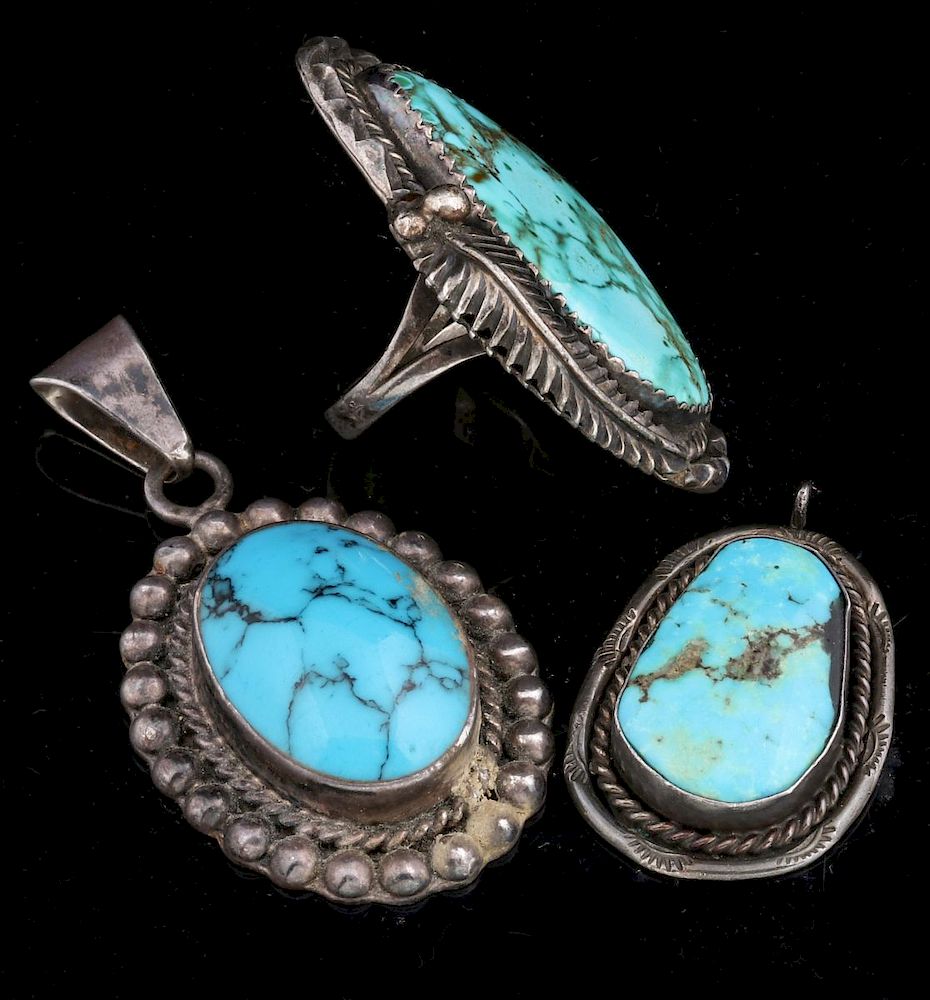 Appraisal: STERLING SILVER AND TURQUOISE RING AND PENDANTS A vintage Navajo