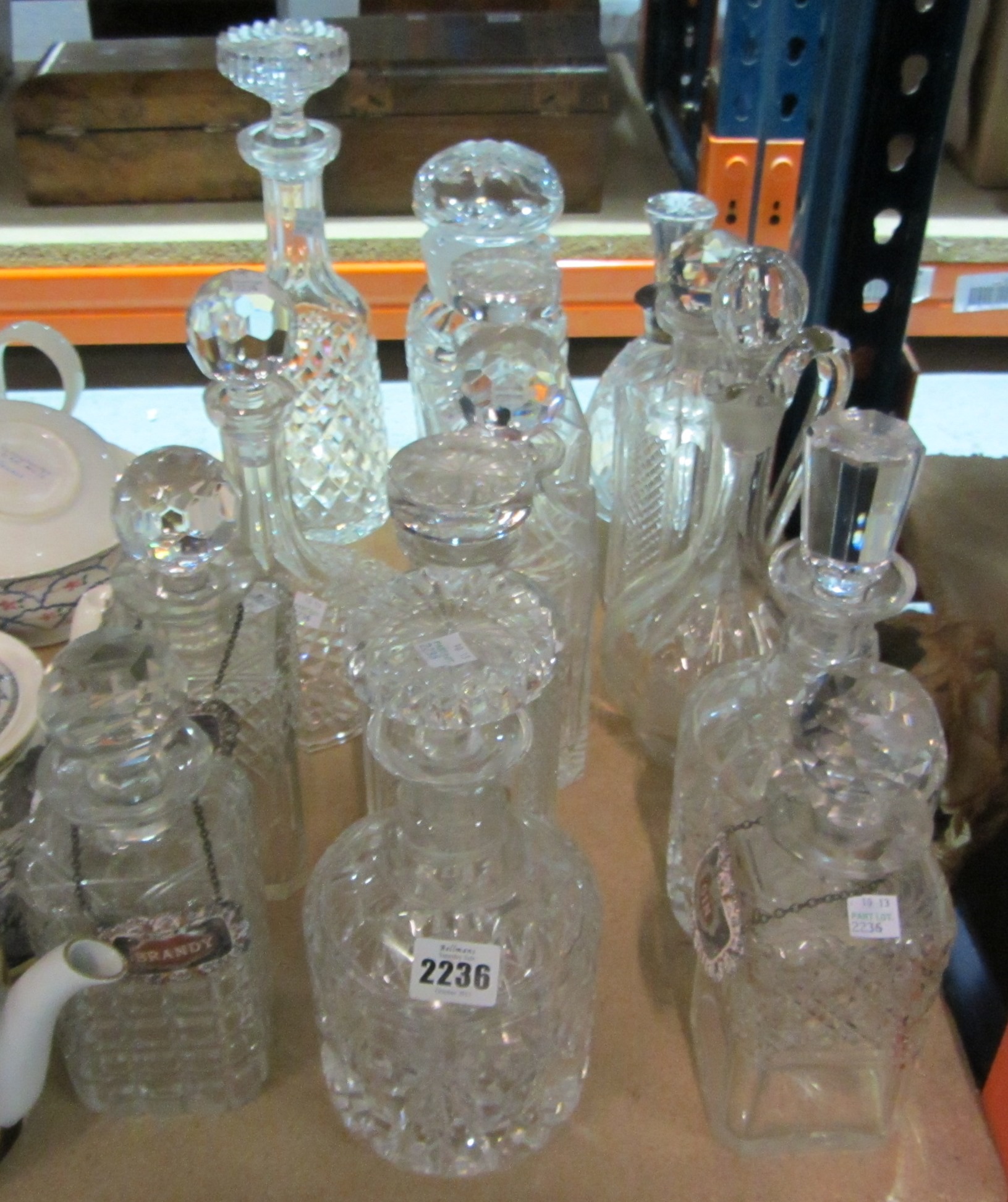 Appraisal: A group of fourteen mixed cut glass decanters and stoppers