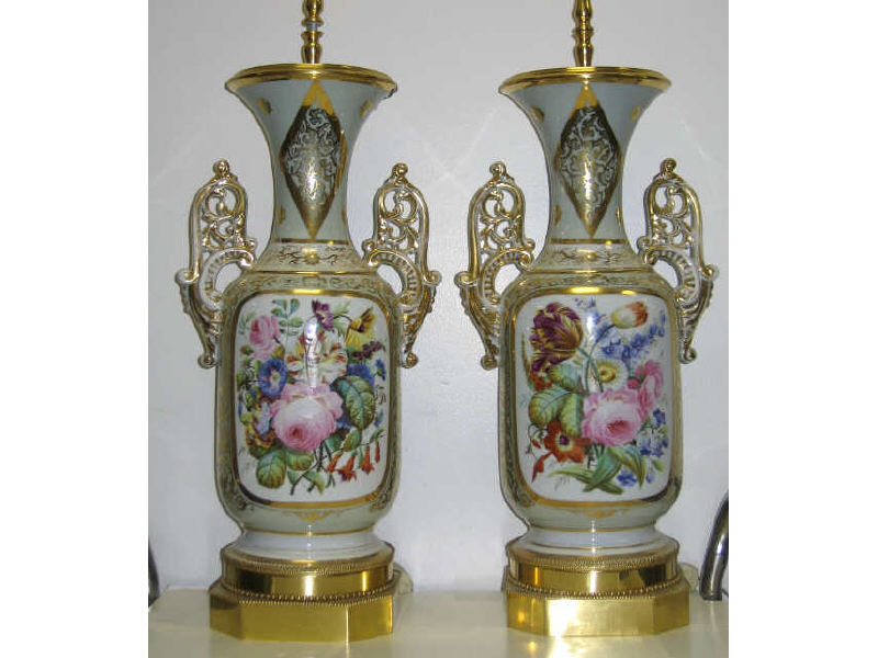 Appraisal: PAIR OF GERMAN PORCELAIN VASES Each footed cylindrical body with