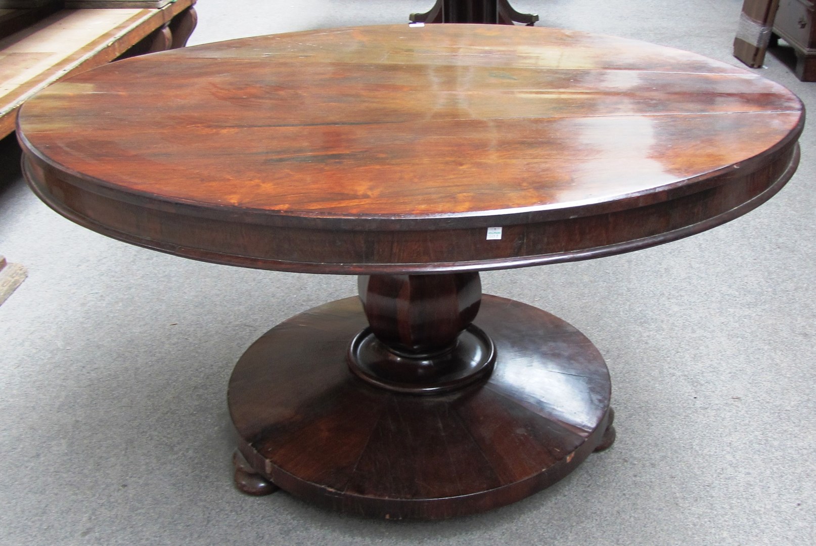 Appraisal: A William IV rosewood loo table with oval snap top