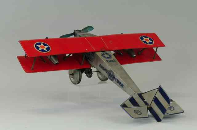 Appraisal: MARX ARMY BOMBER C lithographed tin silver body with red