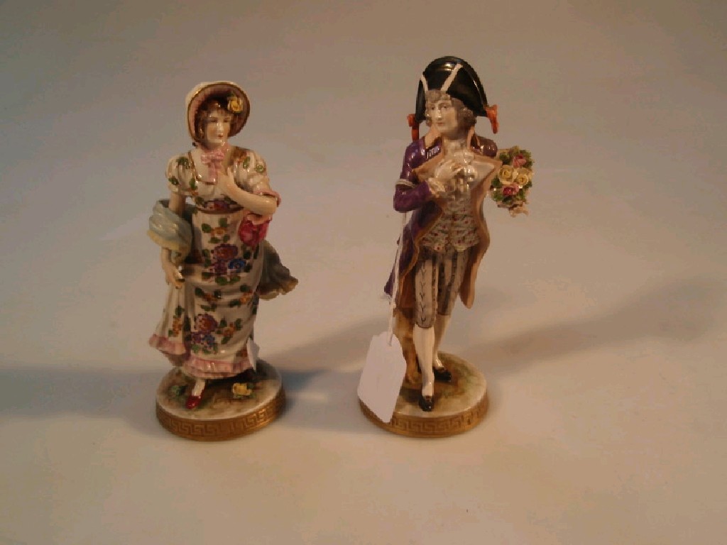 Appraisal: A pair of German porcelain figures of a man and