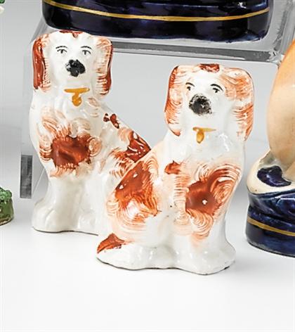 Appraisal: Pair of Staffordshire red and white spaniels mid- th century