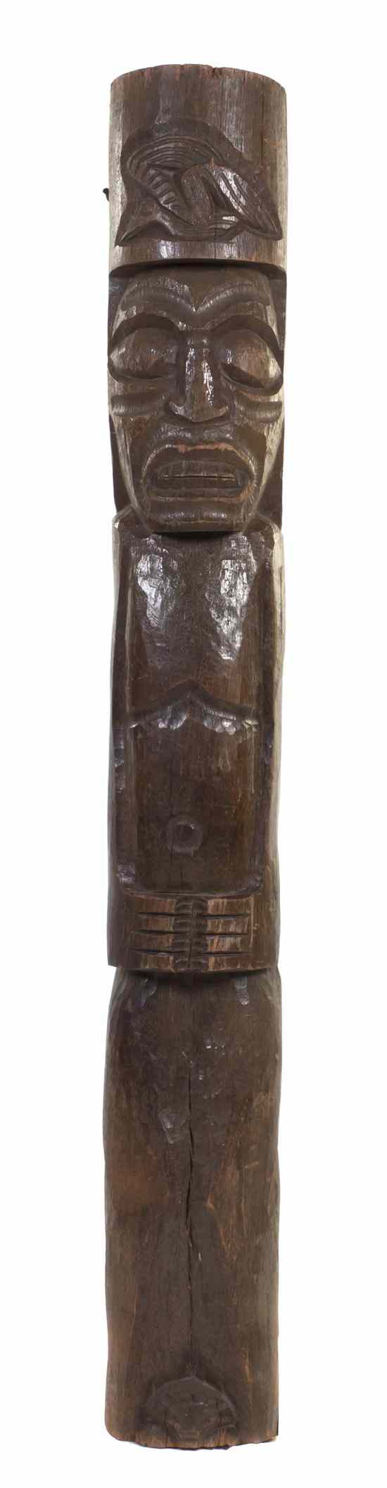 Appraisal: A Carved Wood Tiki Totem of cylindrical form depicting a