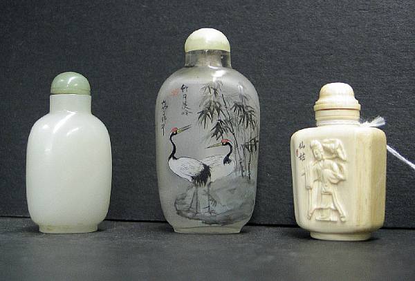 Appraisal: Three snuff bottles Including one th Century fashioned from white