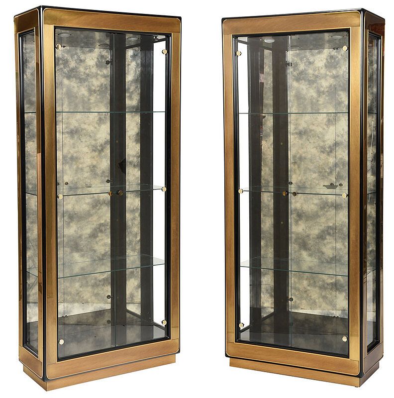 Appraisal: Pair Mastercraft Ebonized Lighted Vitrine Cabinets late th st century