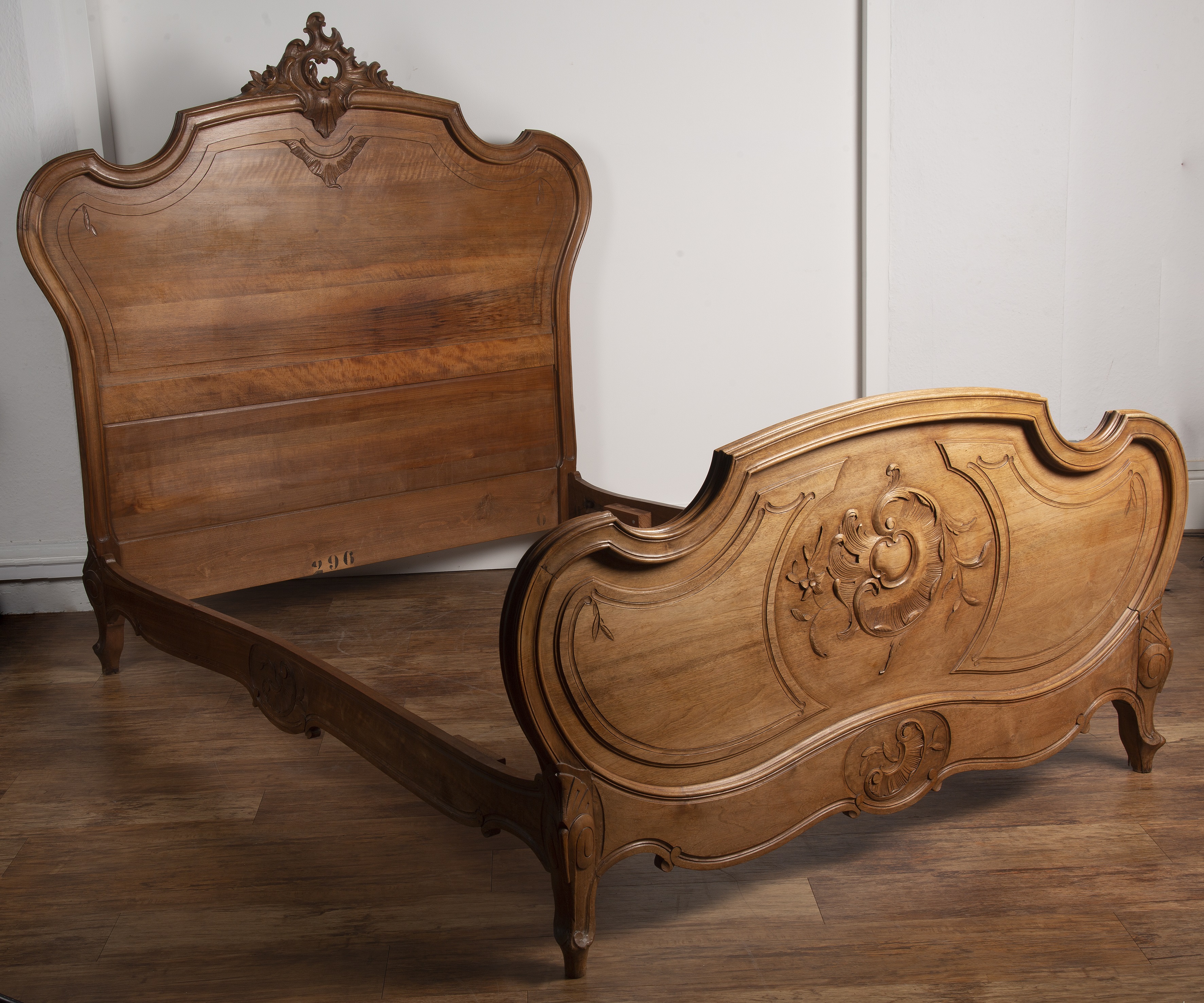 Appraisal: Walnut carved double bedsteadFrench late th Century with carved cartouche