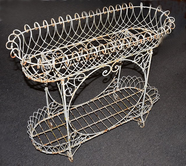 Appraisal: A VICTORIAN PAINTED WIREWORK TWO TIER PLANTER on scrolling supports