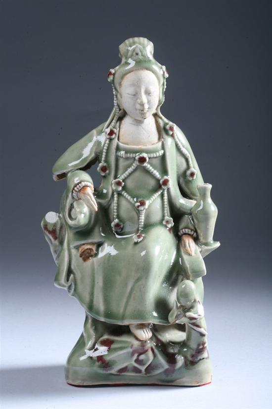 Appraisal: CHINESE CELADON AND COPPER RED PORCELAIN FIGURE OF GUANYIN Qing