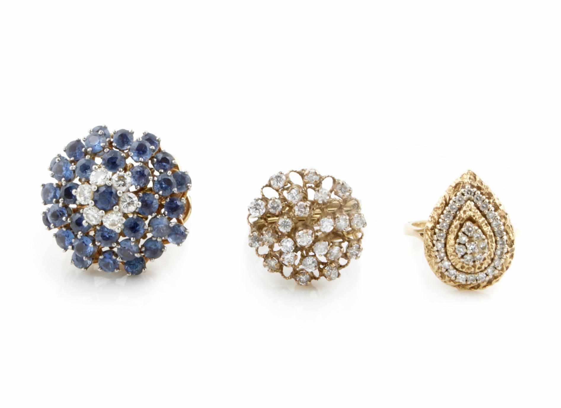 Appraisal: A collection of three gem-set diamond and gold cluster rings