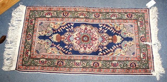 Appraisal: A PAKISTANI BOKHARA STYLE RED GROUND RUNNER m x m