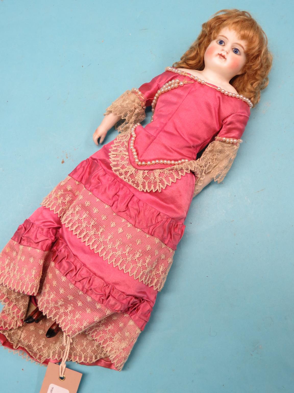 Appraisal: A late th century German shoulder-bisque doll with ceramic lower-limbs