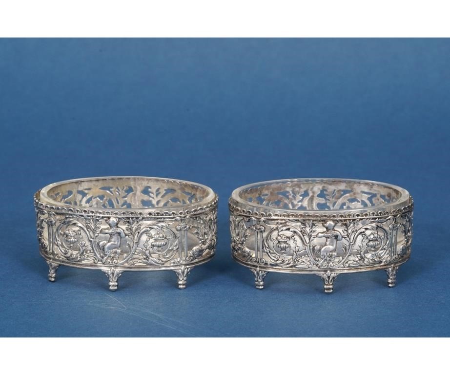 Appraisal: Pair of ornate sterling silver oval master salts with clear