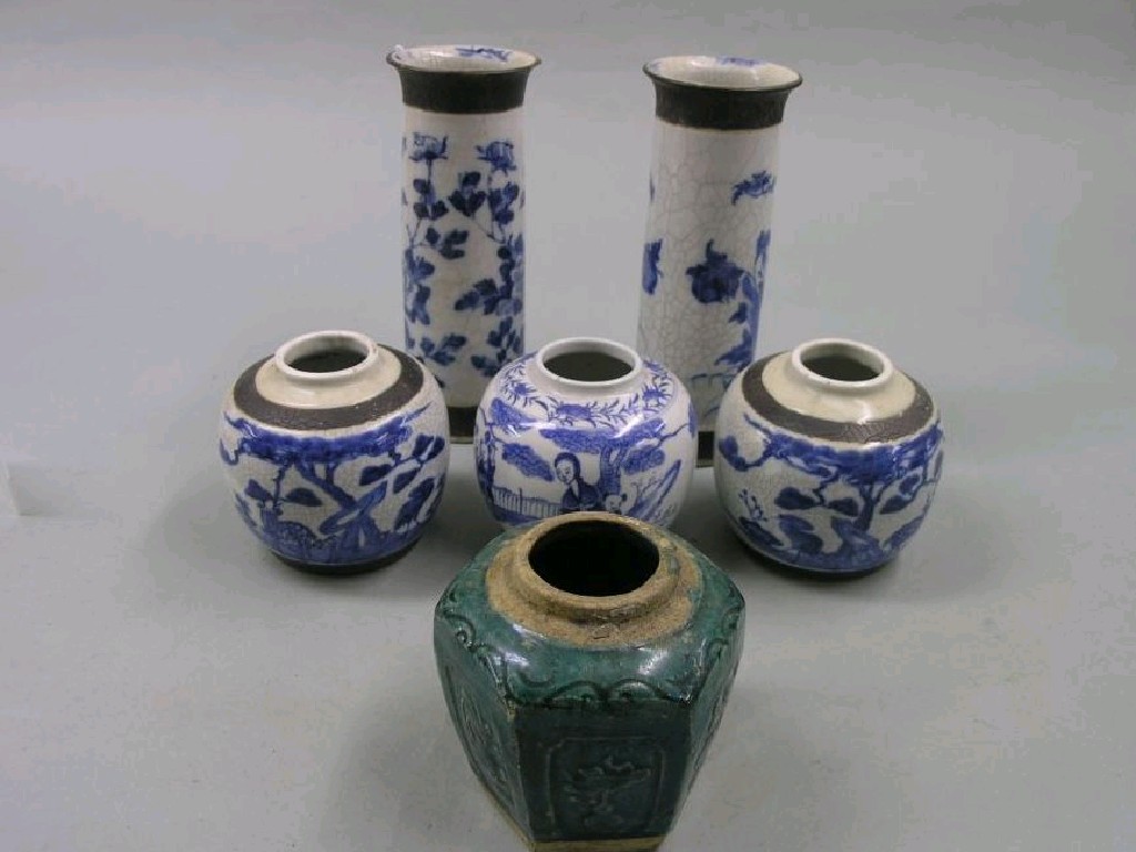 Appraisal: A pair of late th century Chinese cylindrical vases painted