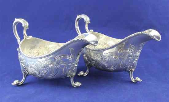 Appraisal: A pair of George III Irish silver sauce boats decorated