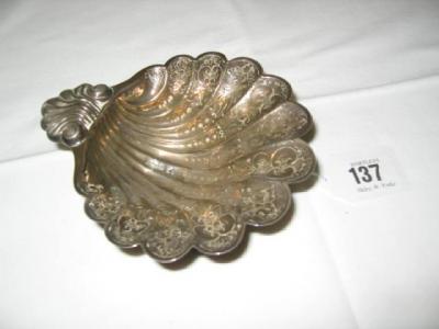 Appraisal: A SHELL DISH chased with flowerheads and with shell moulded